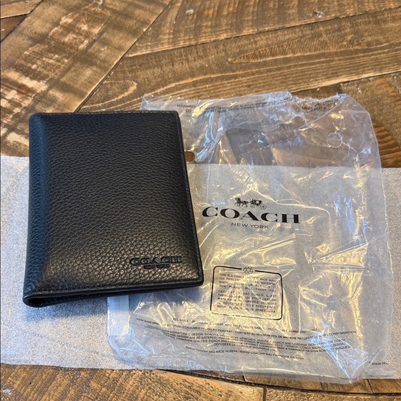 Coach Handbags - Coach Black Textured Leather Passport Holder
